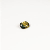 0.90ct Australian parti sapphire oval — golden yellow and teal-green colour zones, face-up — Ruhuna Gemstones