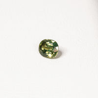 1.70ct Australian parti sapphire cushion — yellow-green centre with forest green crown, face-up — Ruhuna Gemstones