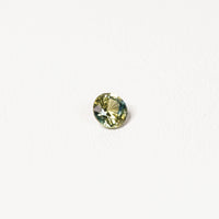 0.90ct Australian parti sapphire round — bright yellow-green body with teal crown accent, face-up — Ruhuna Gemstones