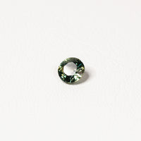 Australian parti sapphire 1.25ct — teal and yellow-green zoning visible at angle — Ruhuna Gemstones