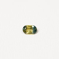 Australian Teal 0.95CT Cushion cut sapphire hand view — Ruhuna Gemstones
