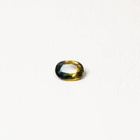 0.90ct Australian parti sapphire oval — golden yellow and teal-green colour zones, face-up — Ruhuna Gemstones