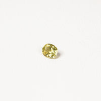 0.85ct Australian yellow-green sapphire cushion — soft pale chartreuse colour, face-up view — Ruhuna Gemstones