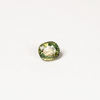 1.70ct Australian parti sapphire cushion — yellow-green centre with forest green crown, face-up — Ruhuna Gemstones