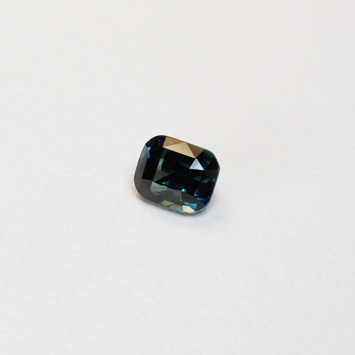 2.64 carat cushion cut teal parti sapphire with blue and green