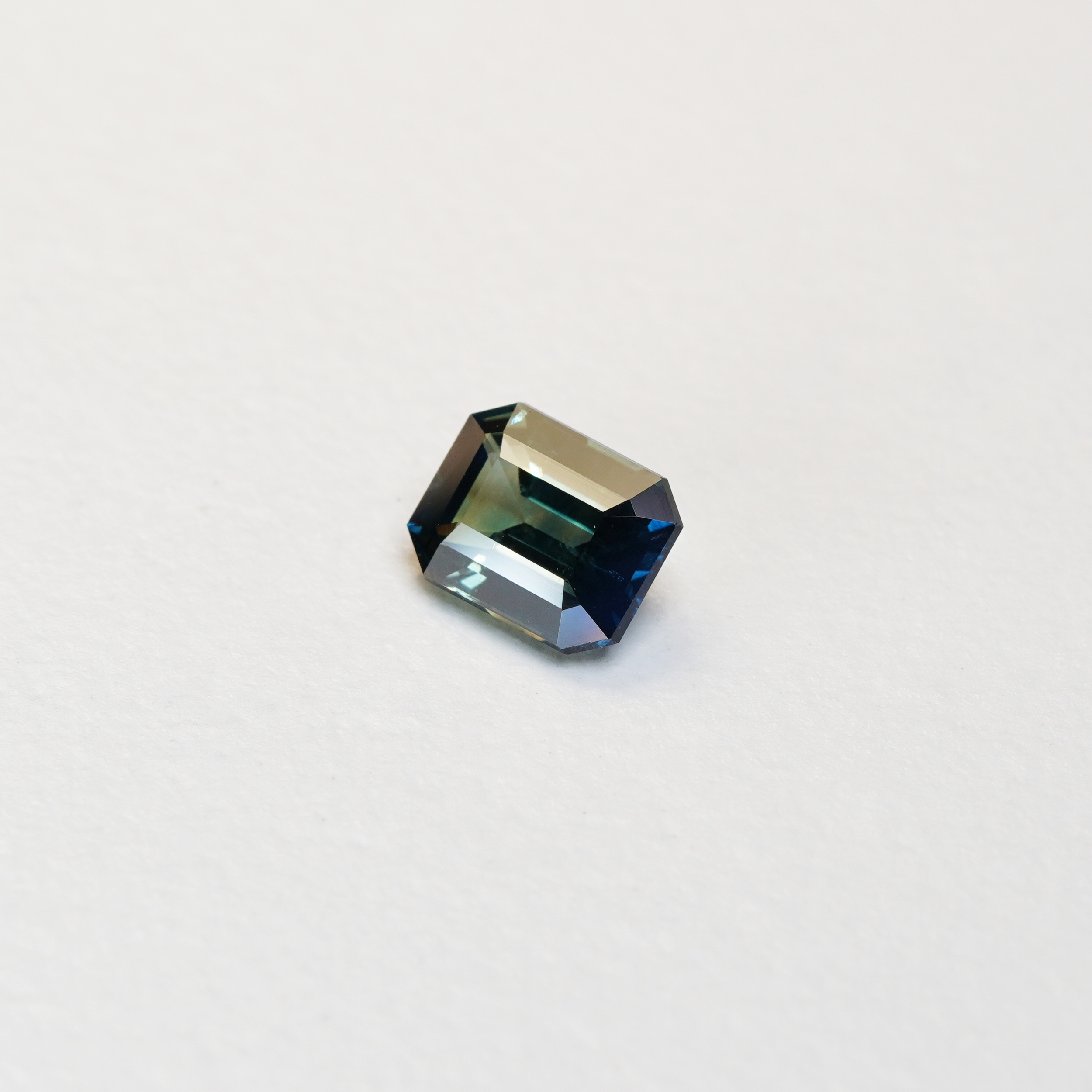 2.02 carat emerald cut teal parti sapphire with blue and green