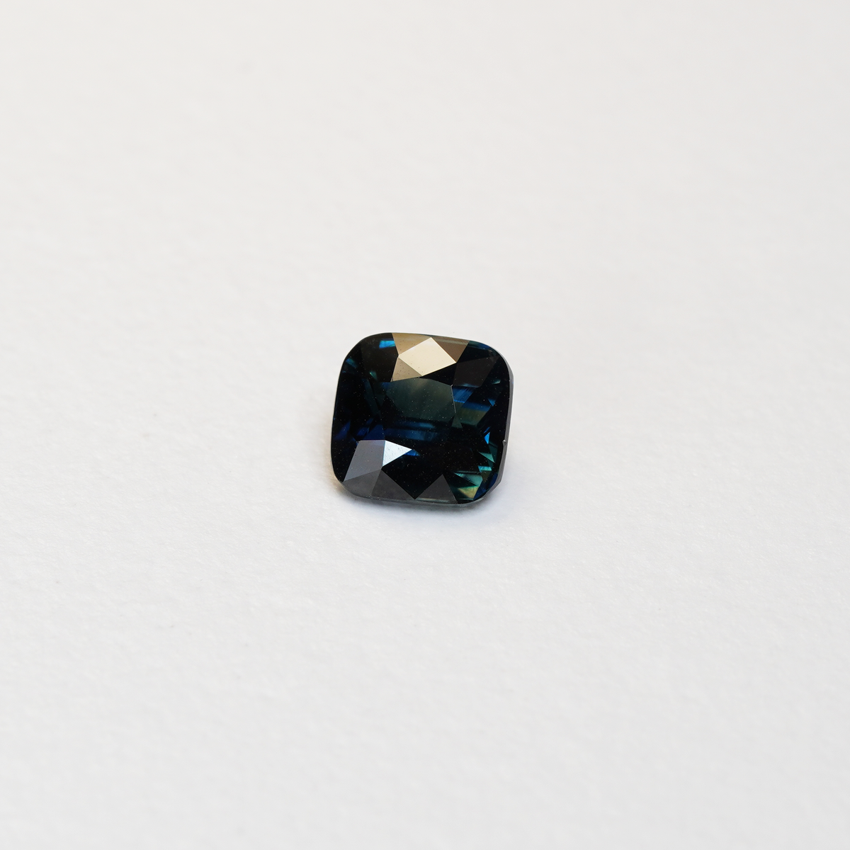 2.11 carat cushion cut teal parti sapphire with green and blue