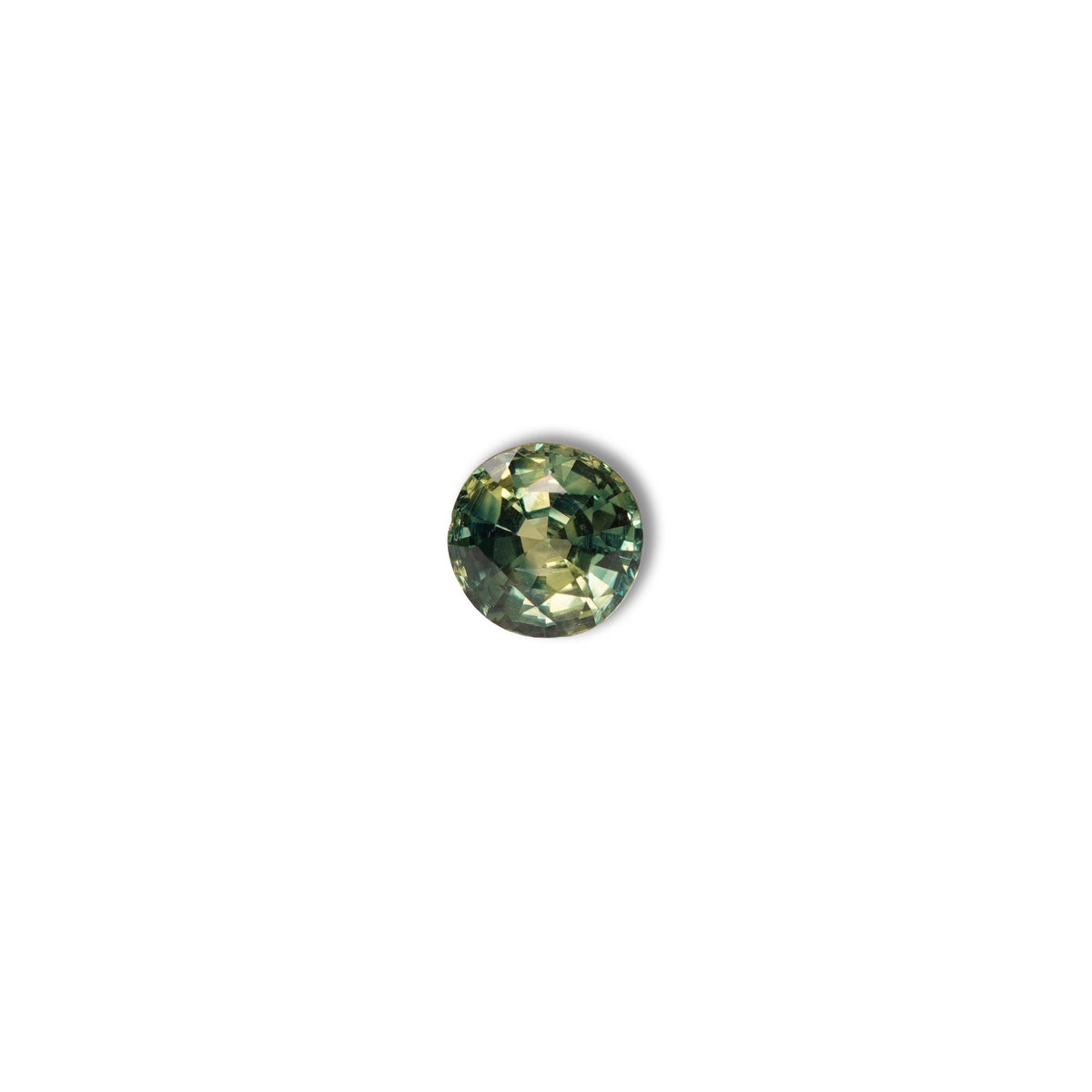 Australian parti sapphire 1.25ct — teal and yellow-green zoning visible at angle — Ruhuna Gemstones