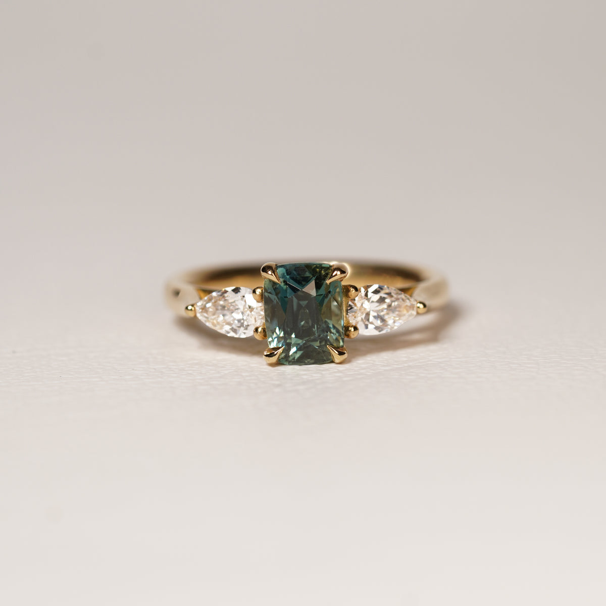 Madagascar 1.55CT Ella 1.55Ct Teal Sapphire Trilogy Ring engagement ring detail view — Ruhuna Gemstones