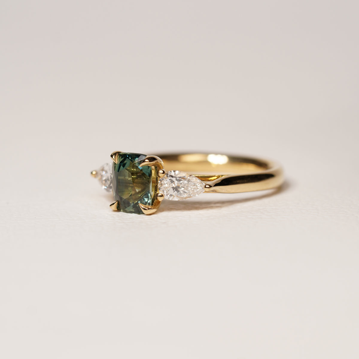 Madagascar 1.55CT Ella 1.55Ct Teal Sapphire Trilogy Ring engagement ring close-up detail — Ruhuna Gemstones