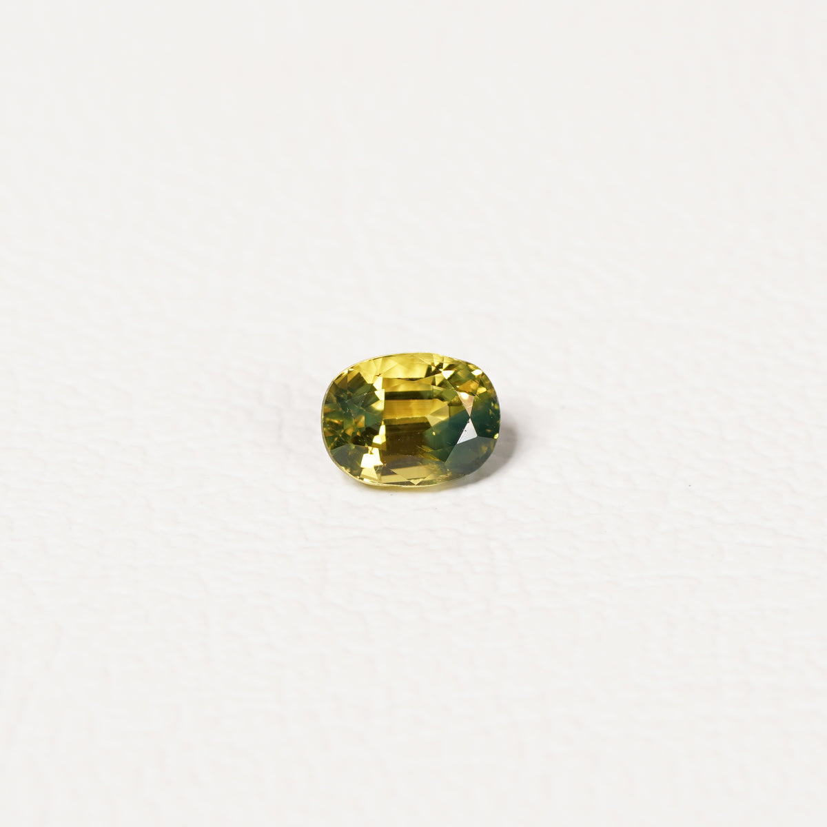 Australian Yellow 1.05CT Oval cut sapphire hand view — Ruhuna Gemstones