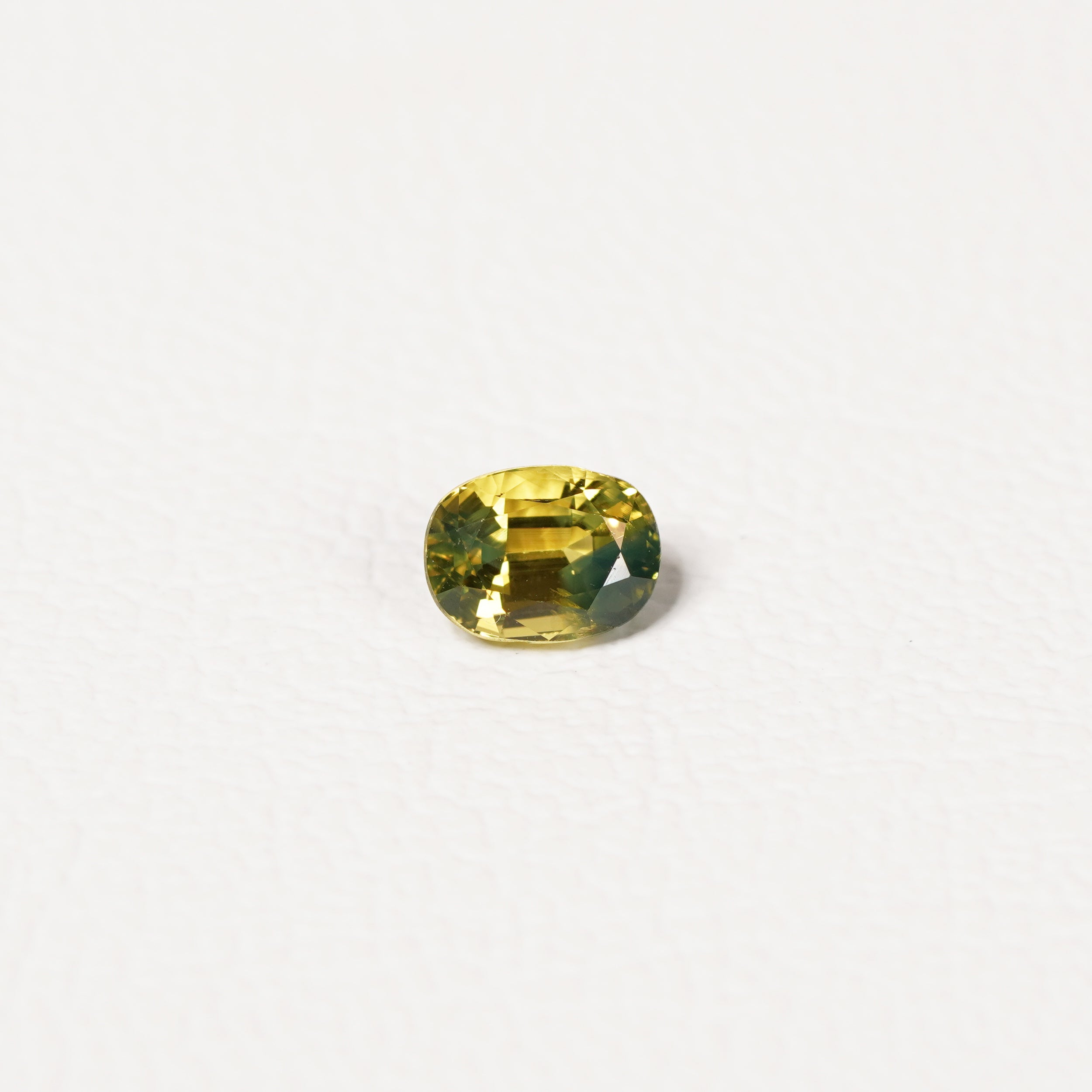 Australian Yellow 1.05CT Oval cut sapphire hand view — Ruhuna Gemstones