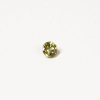 0.95ct Australian yellow-green sapphire round brilliant — vivid lime yellow-green, face-up view — Ruhuna Gemstones