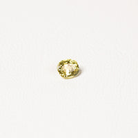 0.85ct Australian yellow-green sapphire cushion — soft pale chartreuse colour, face-up view — Ruhuna Gemstones