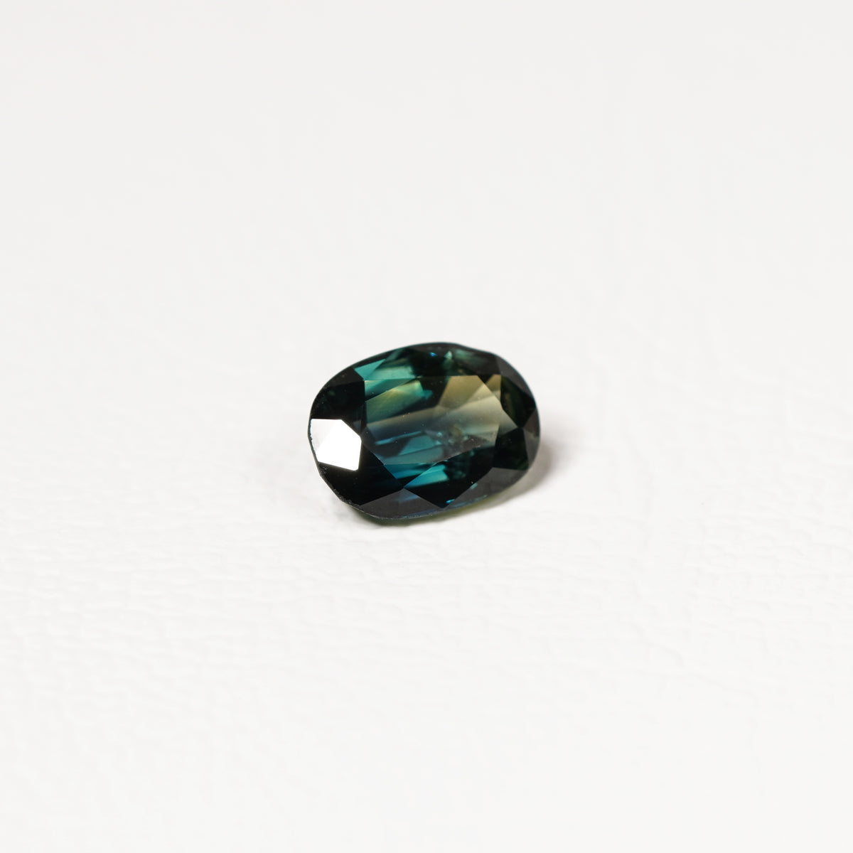 Australian Teal 1.95CT Oval cut sapphire hand view — Ruhuna Gemstones