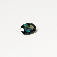 Australian Teal 1.95CT Oval cut sapphire hand view — Ruhuna Gemstones