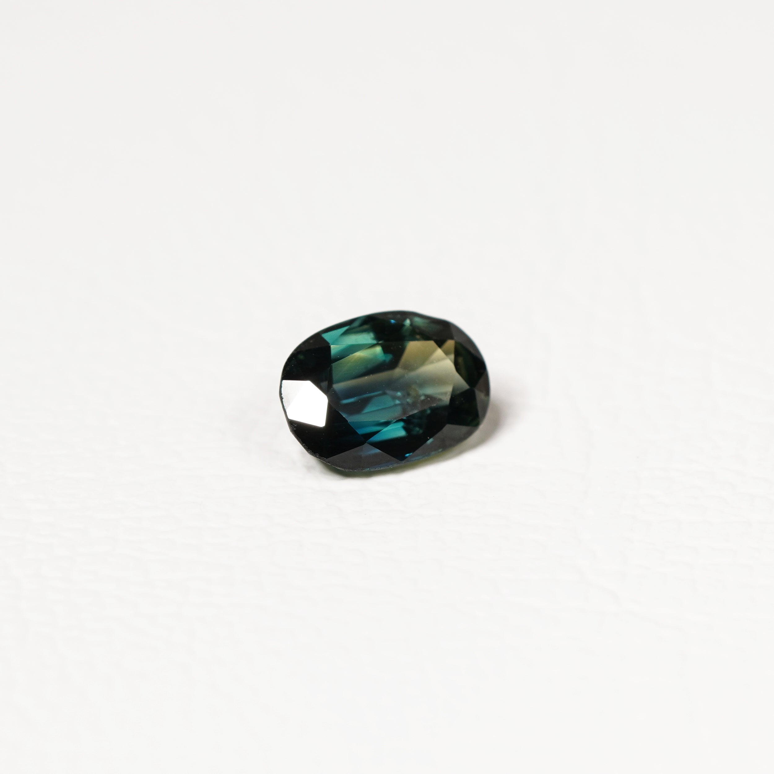 Australian Teal 1.95CT Oval cut sapphire hand view — Ruhuna Gemstones