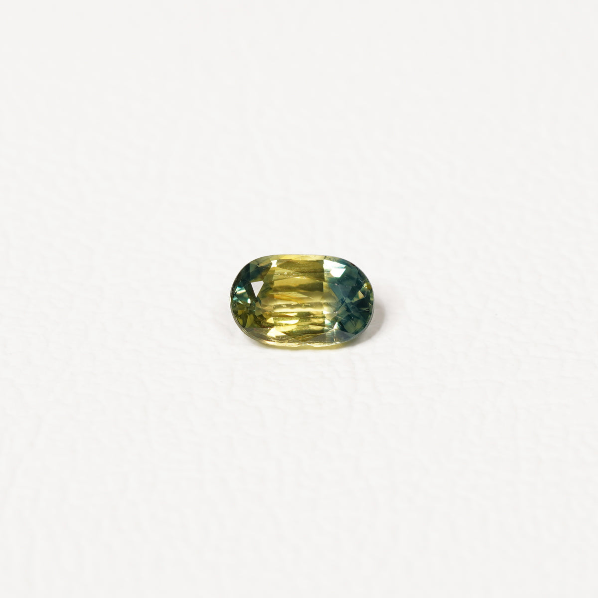 Australian Teal 0.95CT Cushion cut sapphire hand view — Ruhuna Gemstones