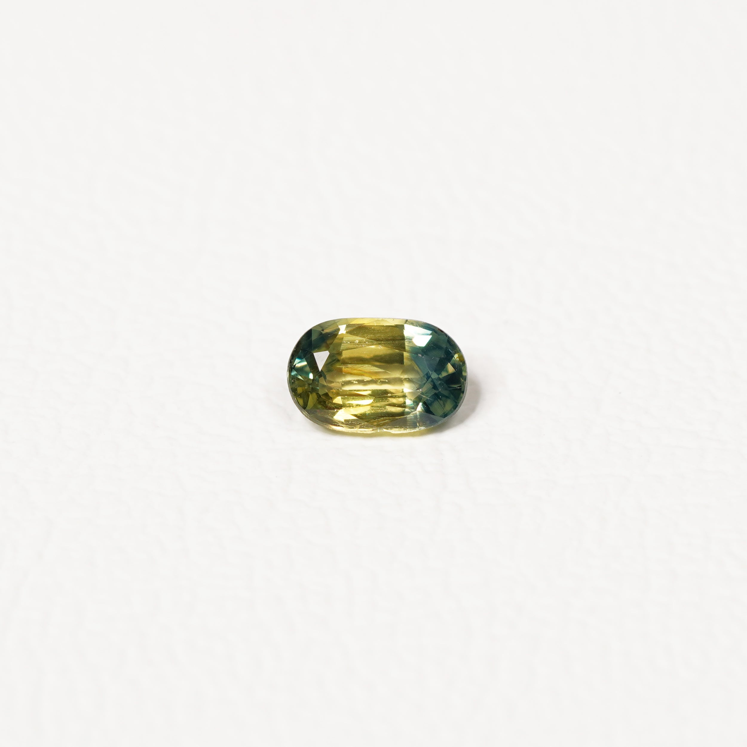 Australian Teal 0.95CT Cushion cut sapphire hand view — Ruhuna Gemstones