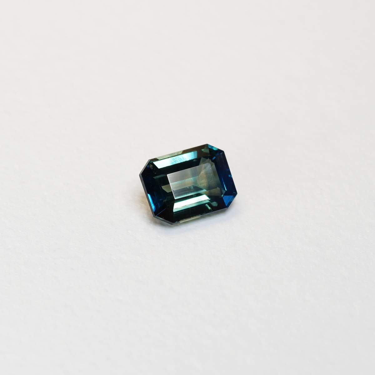 2.02 carat emerald cut teal parti sapphire with blue and green