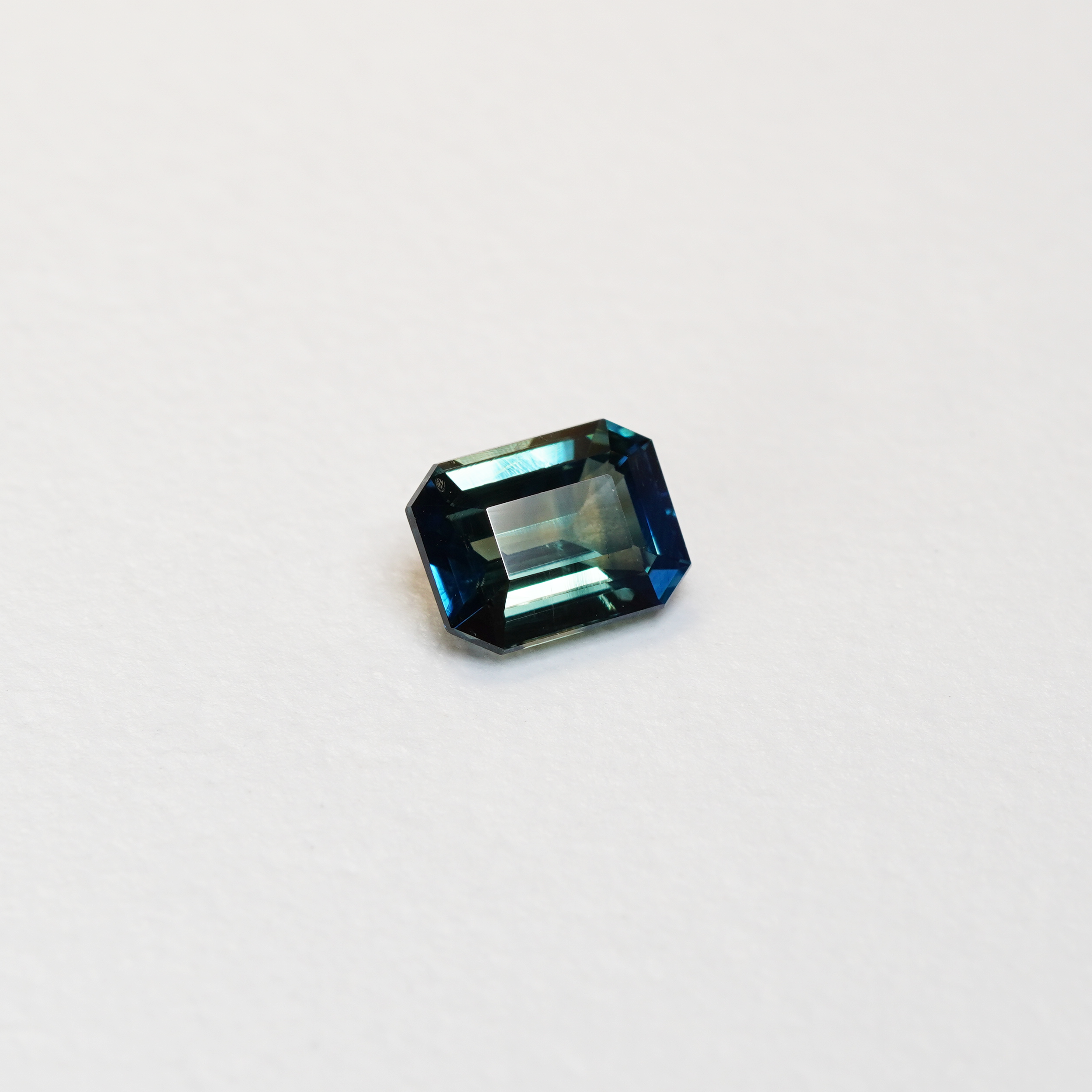 2.02 carat emerald cut teal parti sapphire with blue and green