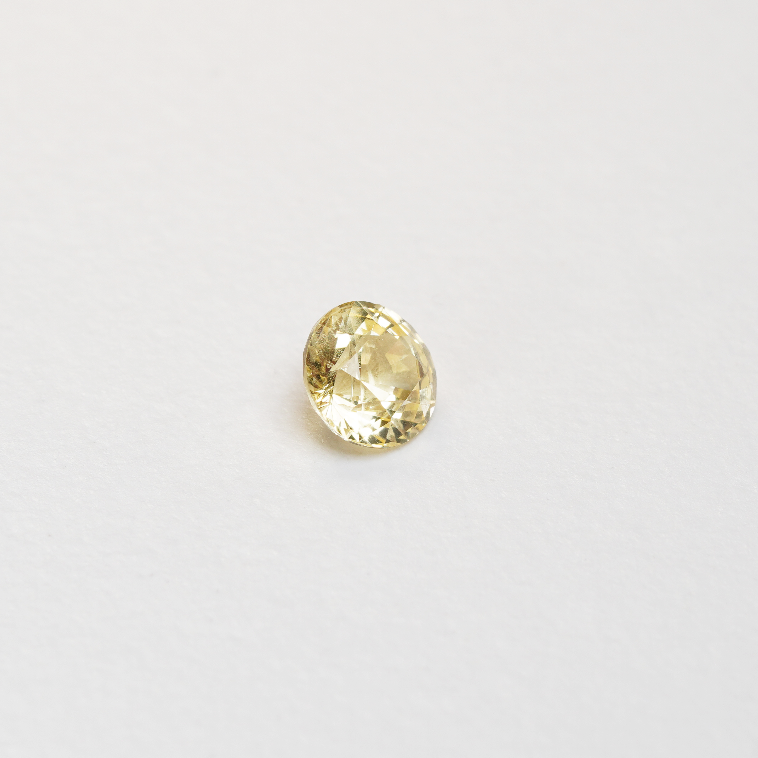1.56 carat round cut yellow ceylon sapphire