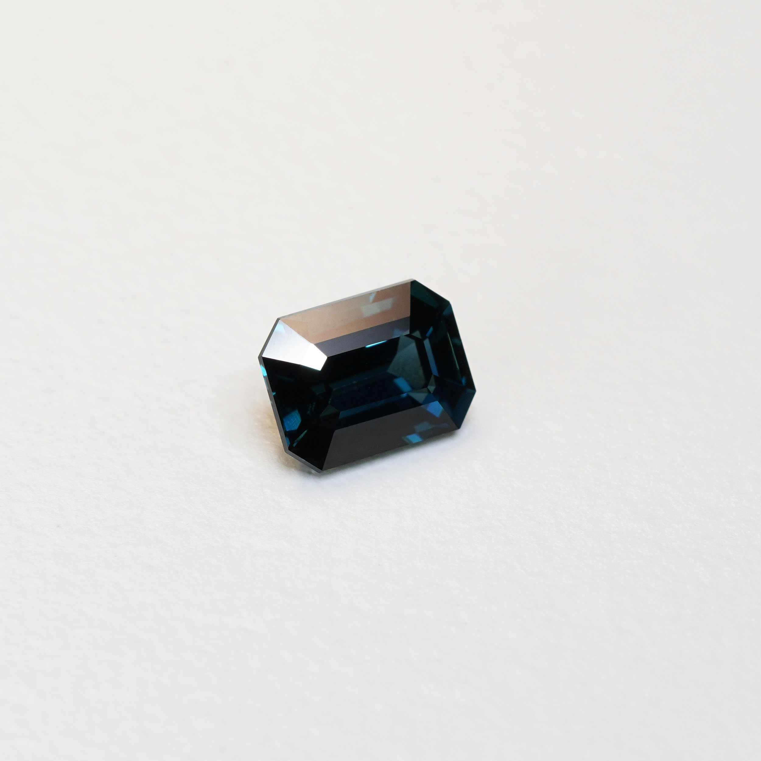 3.06 carat emerald cut teal parti sapphire with blue and green