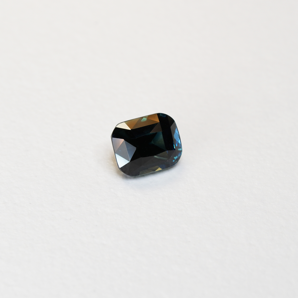 2.64 carat cushion cut teal parti sapphire with blue and green