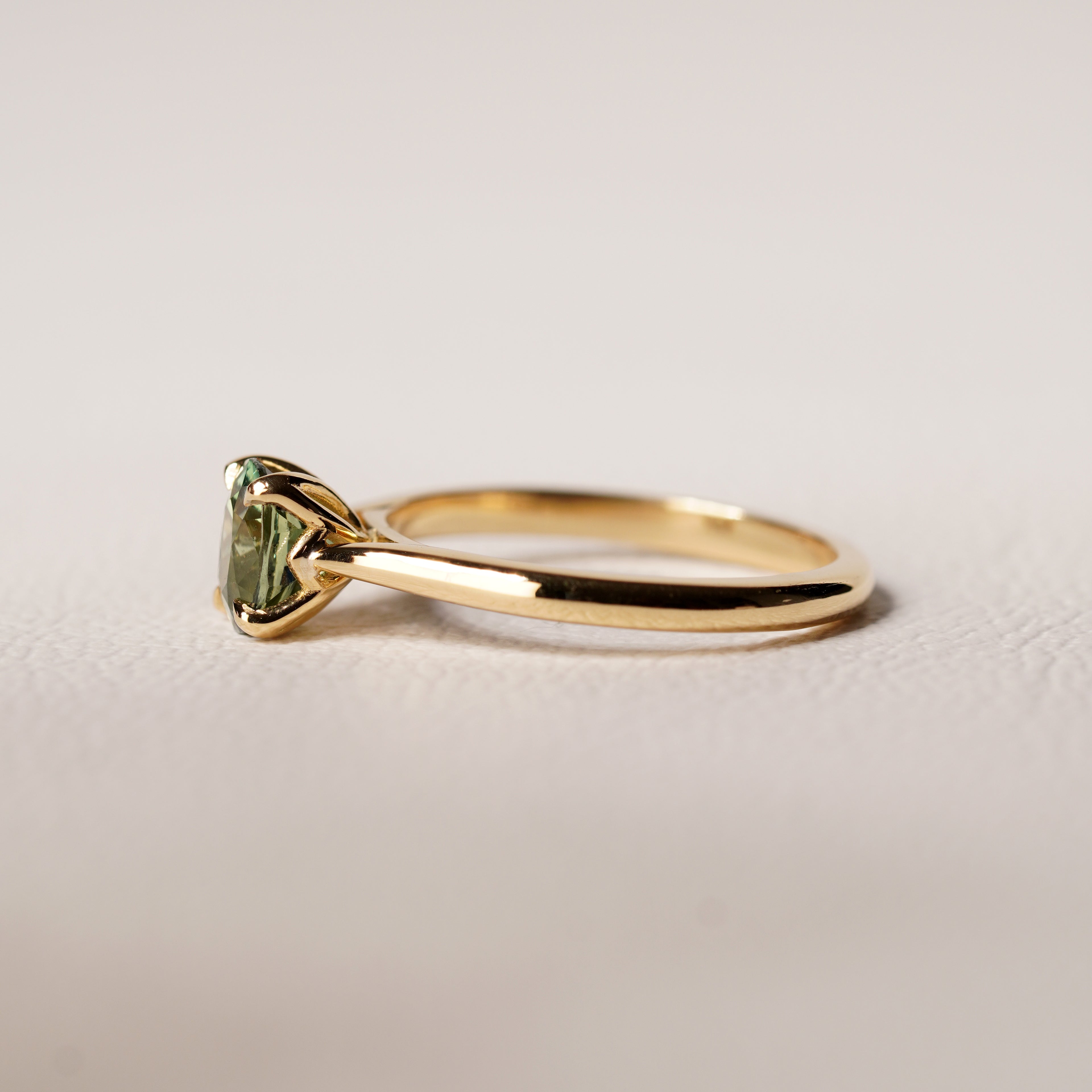 PARTI GREEN SAPPHIRE SOLITAIRE RING SET IN YELLOW GOLD