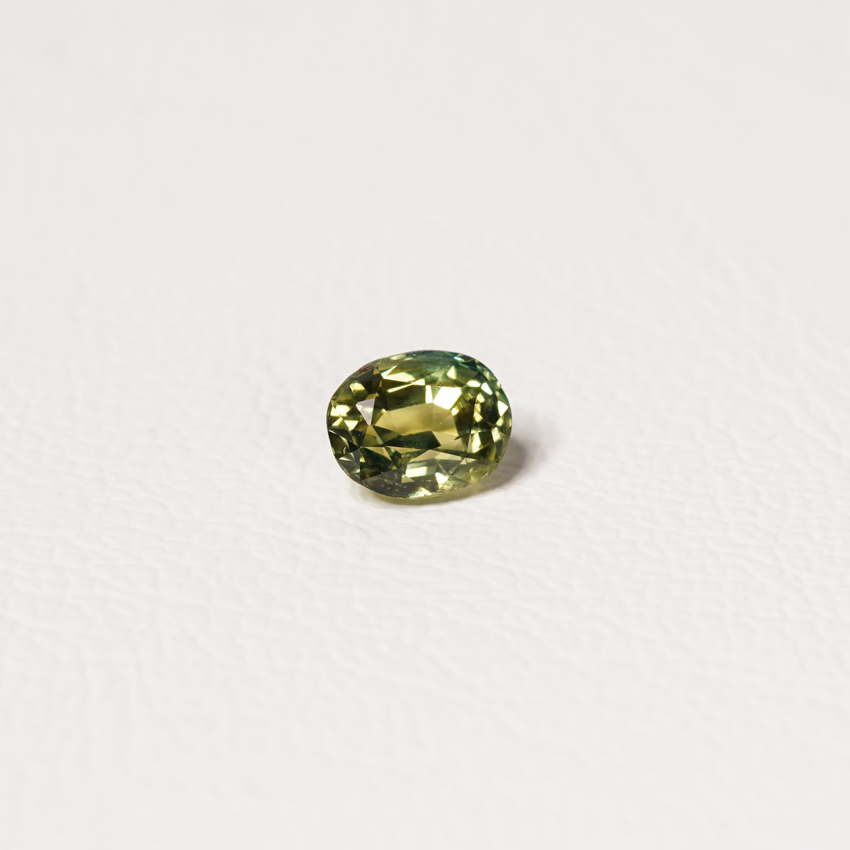 Australian Teal 1.55CT Oval cut sapphire hand view — Ruhuna Gemstones