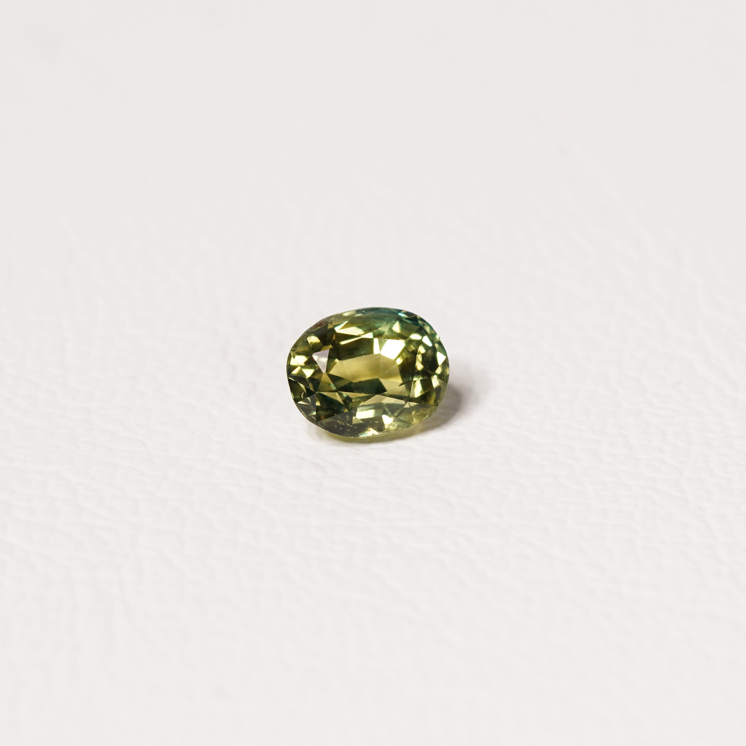 Australian Teal 1.55CT Oval cut sapphire hand view — Ruhuna Gemstones