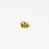 0.85ct Australian yellow-green sapphire cushion — soft pale chartreuse colour, face-up view — Ruhuna Gemstones