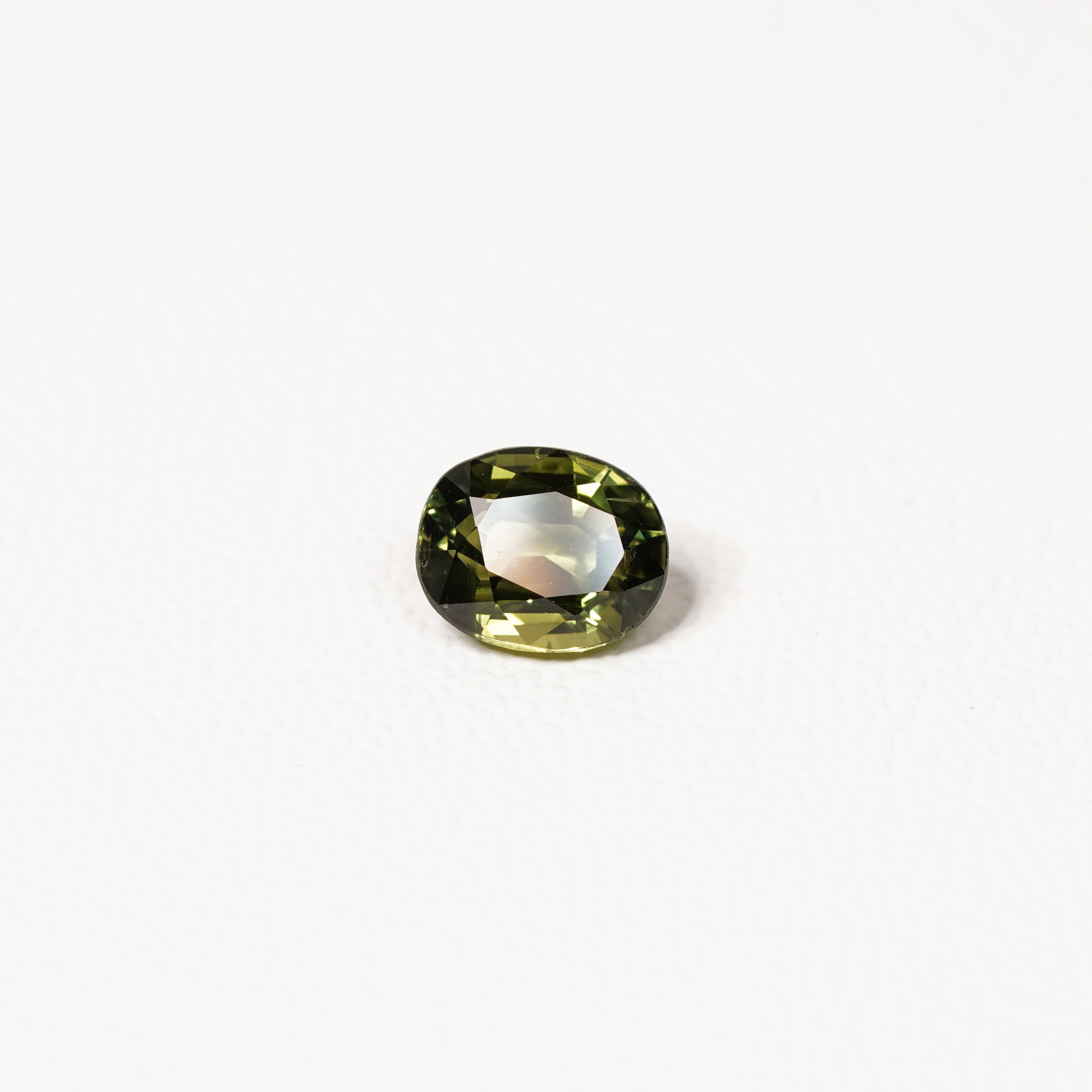 Australian green sapphire 2.10ct oval — saturated green colour zoning at angle — Ruhuna Gemstones