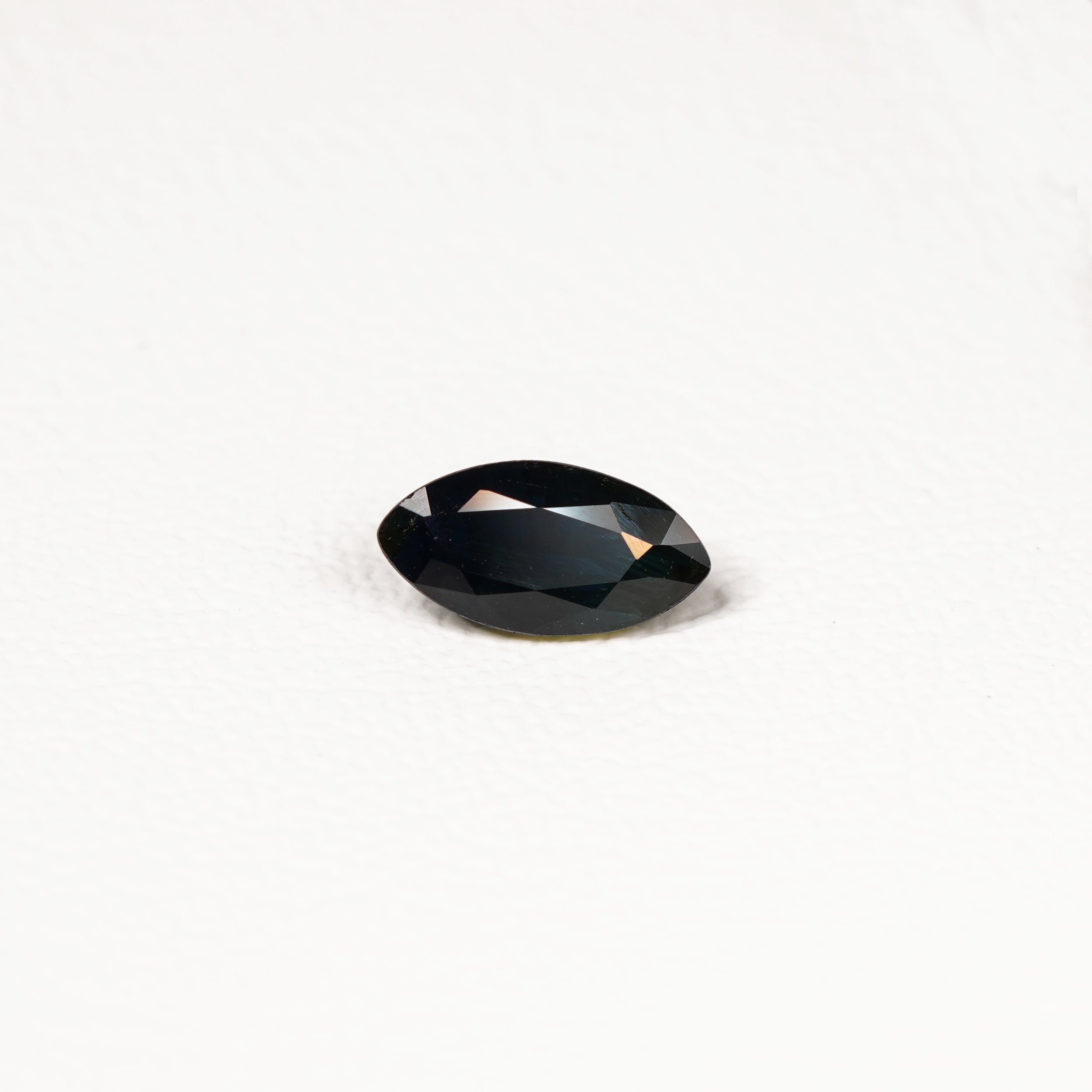1.95ct Australian parti sapphire marquise — deep inky teal face-up with gold flash, face-up view — Ruhuna Gemstones
