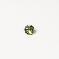 0.95ct Australian parti sapphire round — yellow-green body with vivid teal-blue line through stone — Ruhuna Gemstones