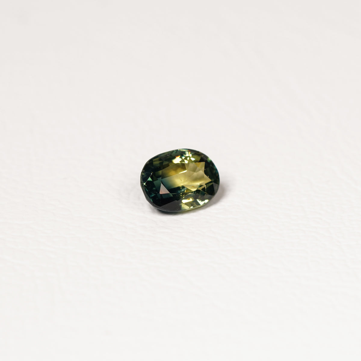 Australian Teal 1.45CT Oval cut sapphire hand view — Ruhuna Gemstones