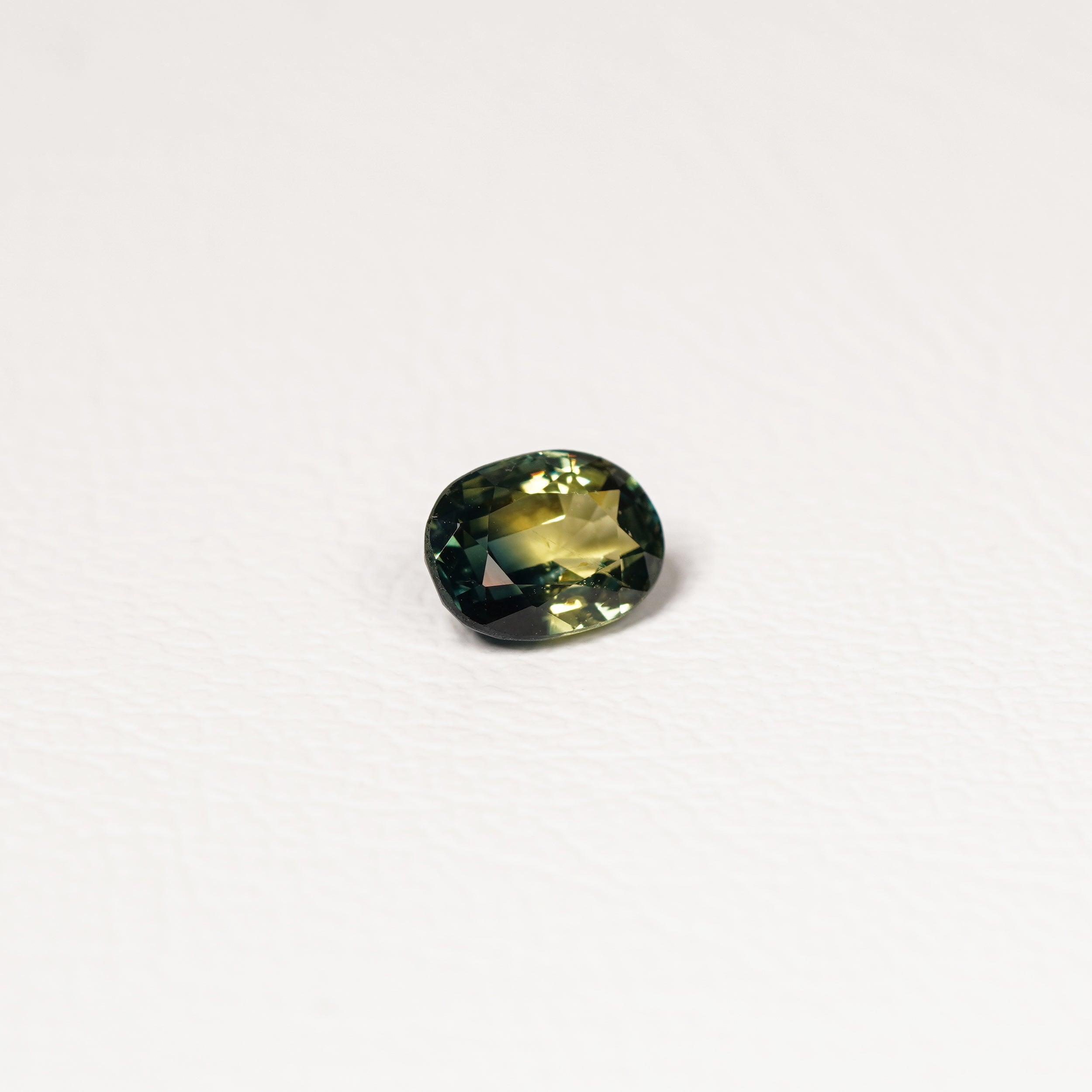 Australian Teal 1.45CT Oval cut sapphire hand view — Ruhuna Gemstones