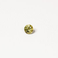 0.95ct Australian yellow-green sapphire round brilliant — vivid lime yellow-green, face-up view — Ruhuna Gemstones