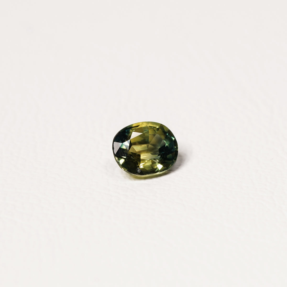 Australian Teal 1.55CT Oval cut sapphire hand view — Ruhuna Gemstones