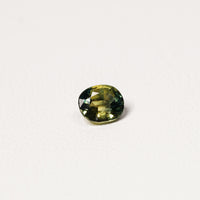 Australian Teal 1.55CT Oval cut sapphire hand view — Ruhuna Gemstones