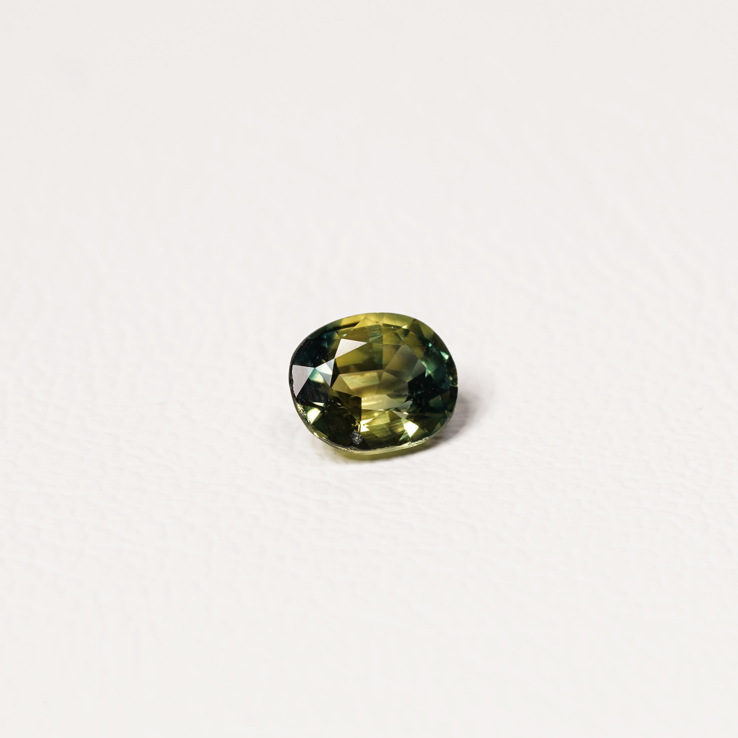 Australian Teal 1.55CT Oval cut sapphire hand view — Ruhuna Gemstones
