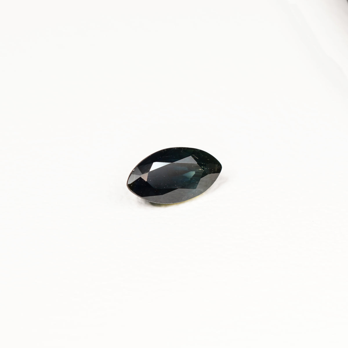 1.95ct Australian parti sapphire marquise — deep inky teal face-up with gold flash, face-up view — Ruhuna Gemstones