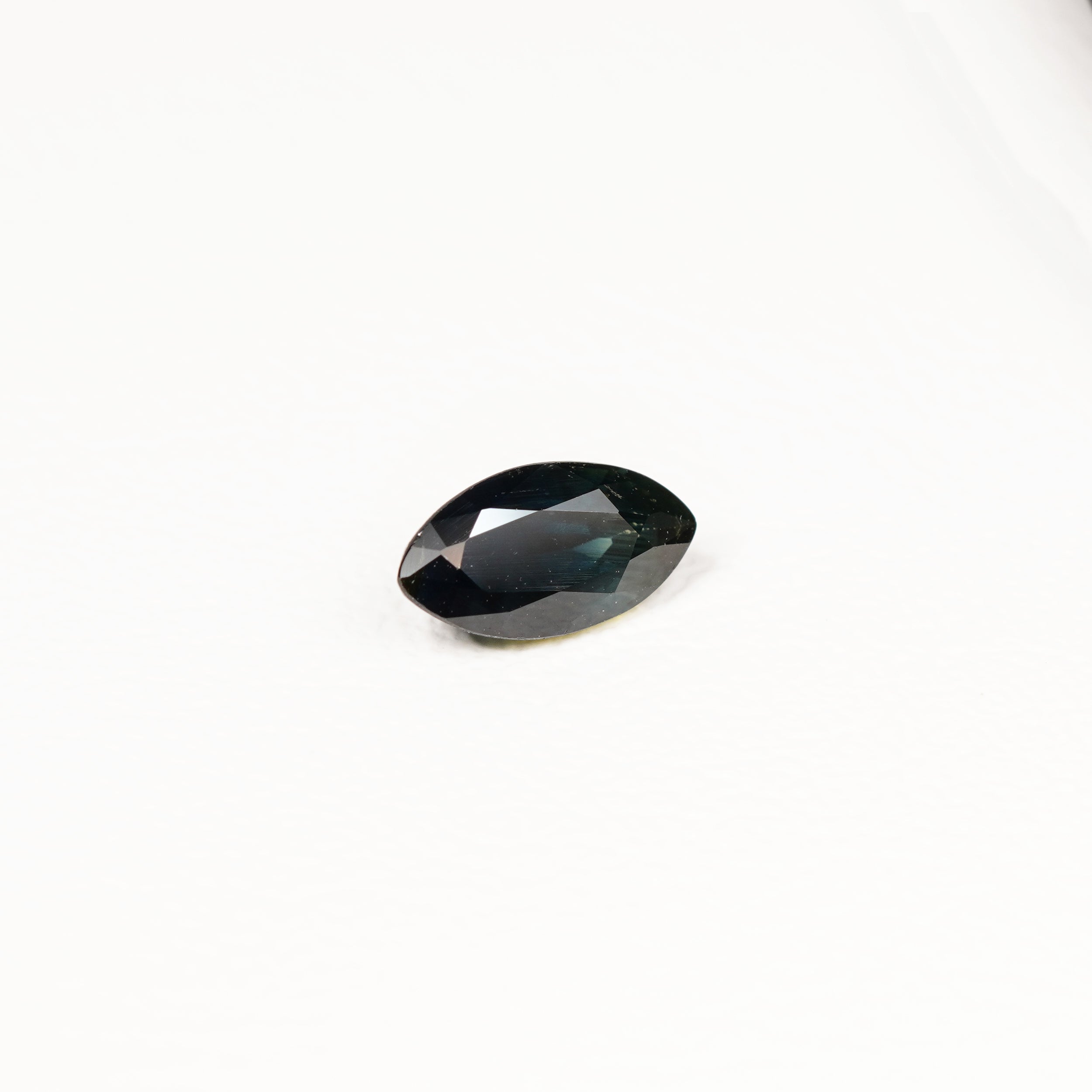 1.95ct Australian parti sapphire marquise — deep inky teal face-up with gold flash, face-up view — Ruhuna Gemstones
