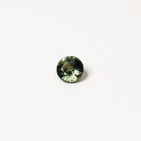 Australian parti sapphire 1.25ct — teal and yellow-green zoning visible at angle — Ruhuna Gemstones