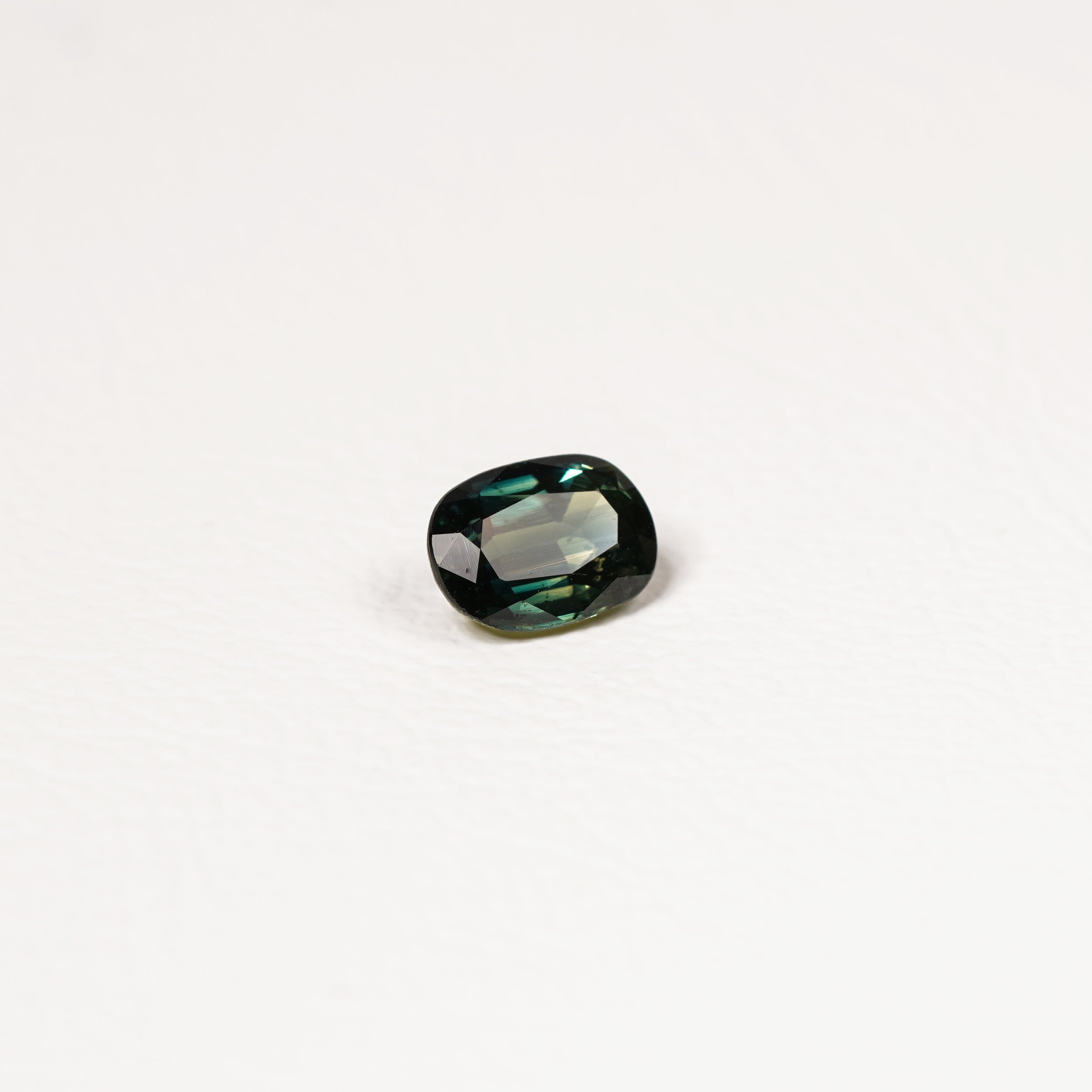 Australian Teal 1.15CT Oval cut sapphire hand view — Ruhuna Gemstones