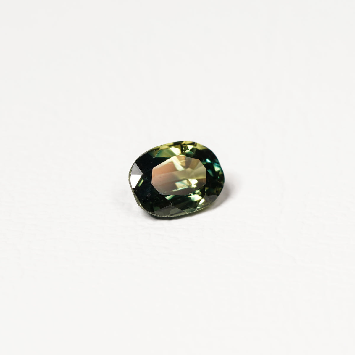 Australian Teal 1.95CT Oval cut sapphire hand view — Ruhuna Gemstones