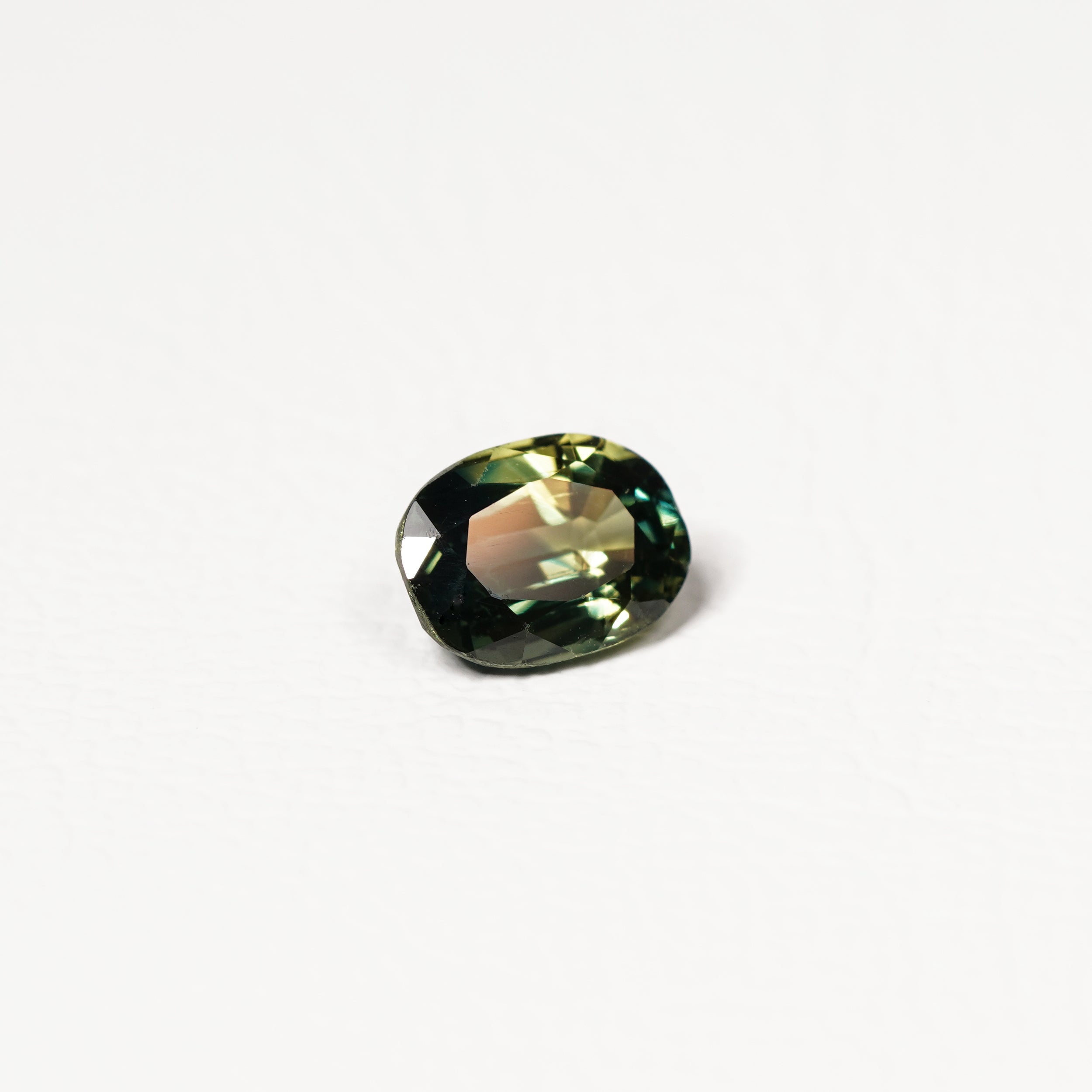 Australian Teal 1.95CT Oval cut sapphire hand view — Ruhuna Gemstones
