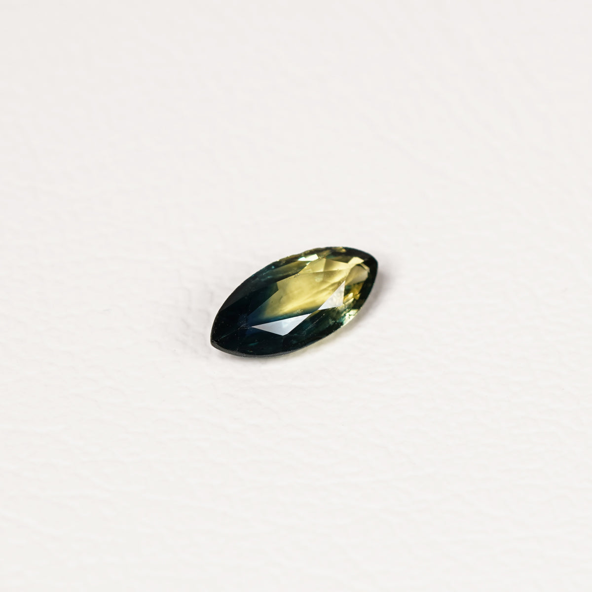 Australian Teal 1.1CT Marquise cut sapphire hand view — Ruhuna Gemstones