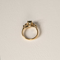 1.55 carat teal parti sapphire engagement ring with pair cut diamonds in 18ct yellow gold