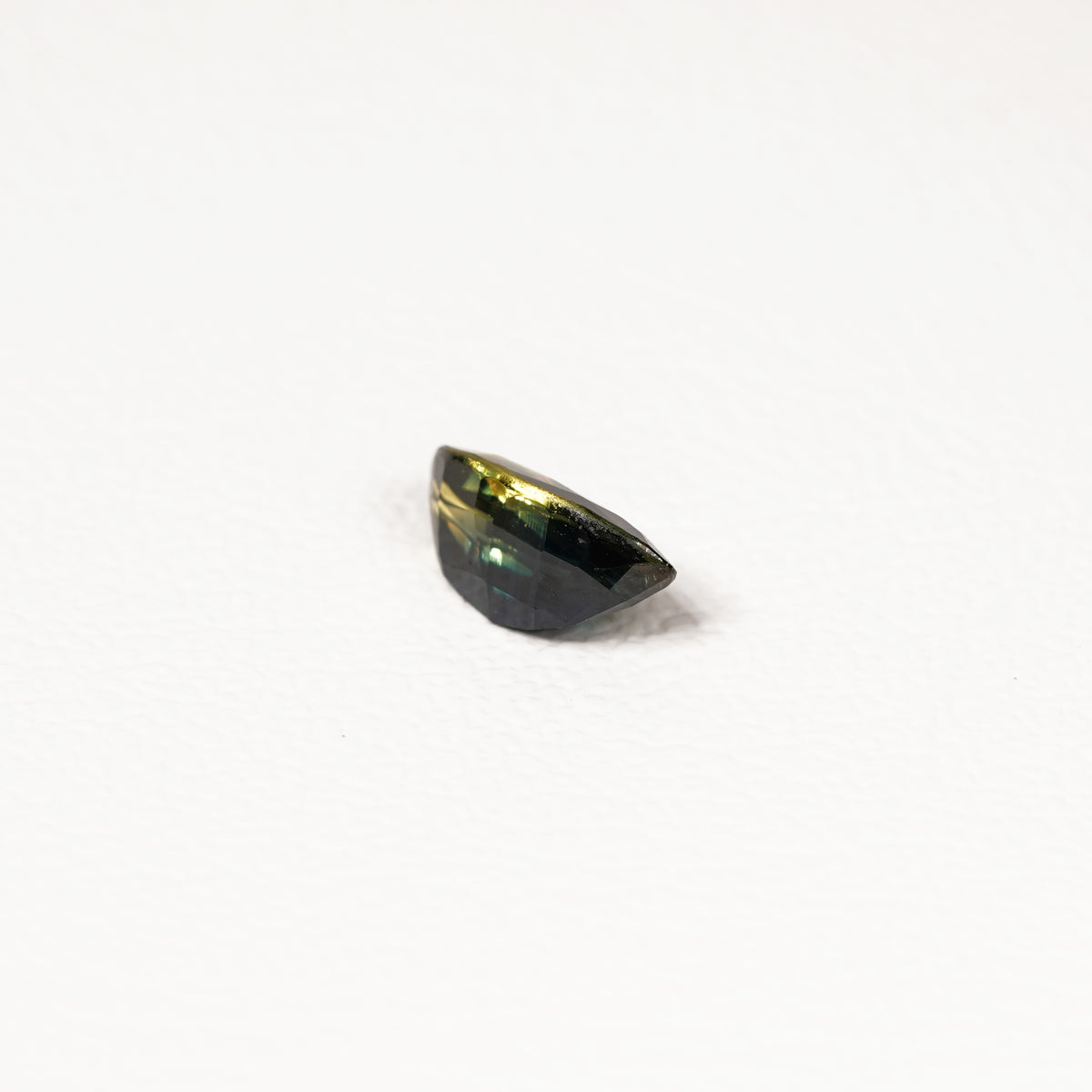 1.95ct Australian parti sapphire marquise — deep inky teal face-up with gold flash, face-up view — Ruhuna Gemstones